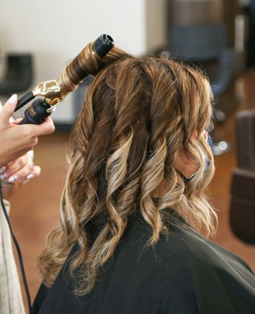 Brunette curls set and finished, side view
