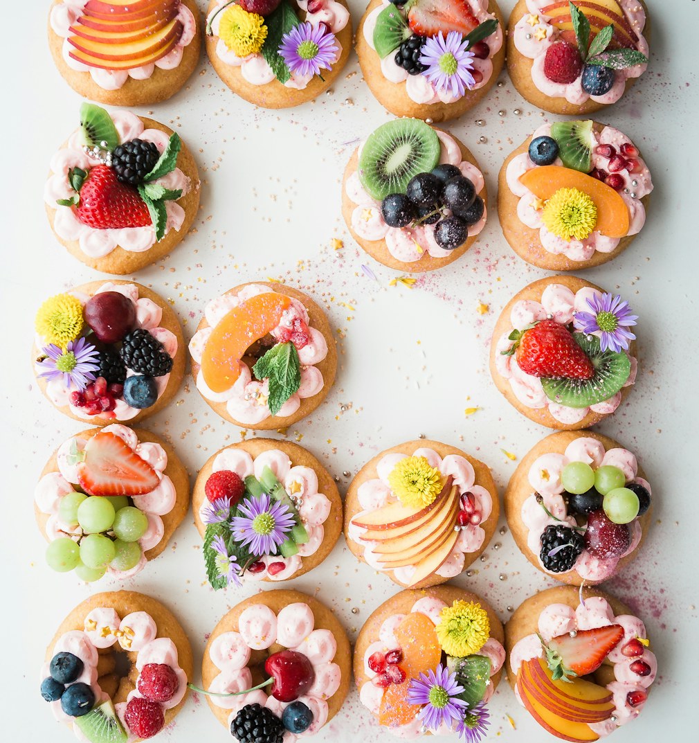 Mini fruit tarts with edible flowers